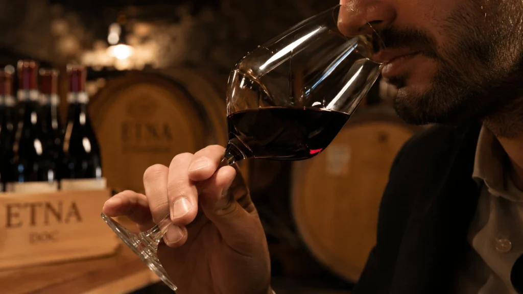 Wines of Etna tasted in the cellar with glass of red wine during a guided tasting